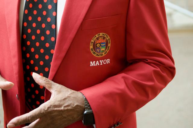 a closeup of the mayor's jacket with the dayton seal