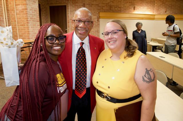 student Azariah Crosby, Dayton mayor Jeffrey Mims Jr., and assistant professor Brittany Brake