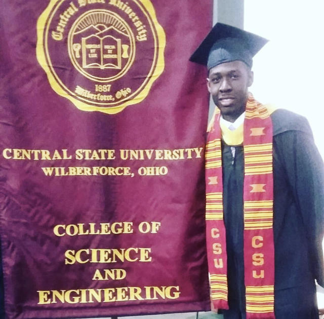 a young black man in central state university graduation regalia