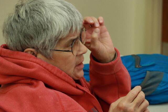 A conference attendee participates in a small-group discussion with other farmers