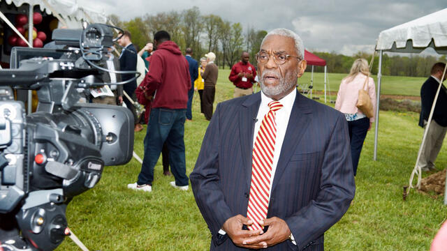John Garland, President Emeritus at Central State University, is interviewed on camera at the Land-Grant open house and research facility groundbreaking